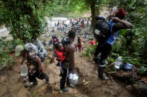 Haitian migrants cross the Darien Gap, heading to Panama, on September 26, 2021, on their way trying to reach the US.