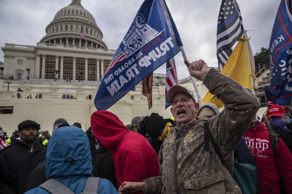 Demonstrators swarm the U.S. Capitol building during a protest in Washington, D.C., U.S., on Wednesday, Jan. 6, 2021. (Victor J. Blue/Bloomberg via Getty Images)​