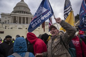 Demonstrators swarm the U.S. Capitol building during a protest in Washington, D.C., U.S., on Wednesday, Jan. 6, 2021. (Victor J. Blue/Bloomberg via Getty Images)​