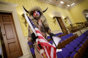 A protester yells inside the Senate Chamber on January 06, 2021 in Washington, DC. (Win McNamee/Getty Images)​