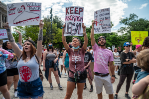 Demonstrators hold up signs at a pro choice abortion protest outside the Texas state capitol on May 29, 2021 in Austin, Texas.