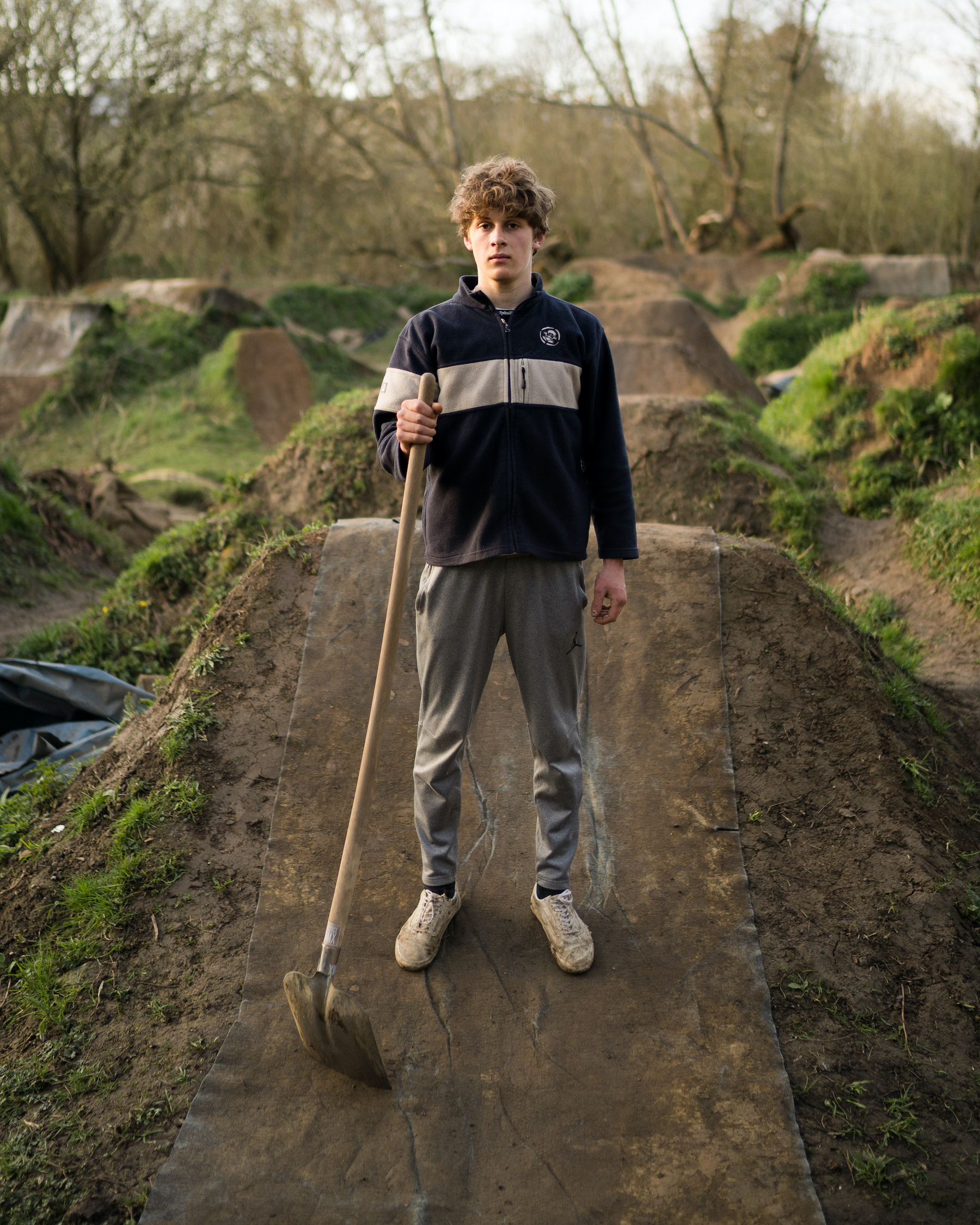 A rider helps dig the jumps.