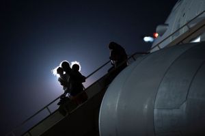 Passengers evacuated from Afghanistan disembark from a British Royal Air Force (RAF) Airbus KC2 Voyager aircraft, after landing at RAF Brize Norton station in southern England on August 24, 2021. - Britain said on August 23 it would urge the United States