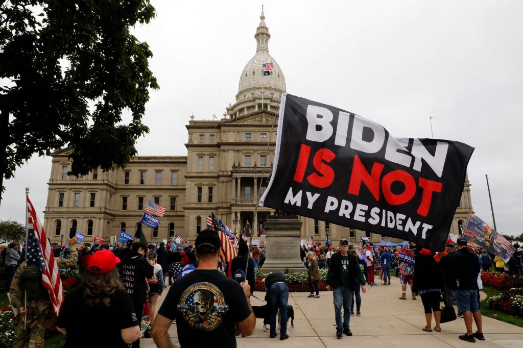 Protesters call for an audit of the 2020 presidential election outside of the Michigan State Capitol in Lansing on October 12, 2021.