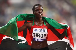 Agnes Jebet Tirop of Kenya celebrates winning bronze in the Women's 10,000 Metres final​.