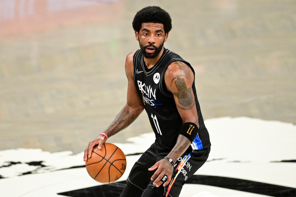 Kyrie Irving of the Brooklyn Nets handles the ball against the Milwaukee Bucks in Game Two of the Second Round of the 2021 NBA Playoffs at Barclays Center on June 07, 2021 in New York City.