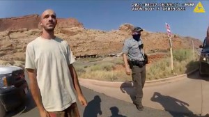 This Aug. 12, 2021 file photo from video provided by The Moab Police Department shows Brian Laundrie talking to a police officer after police pulled over the van he was traveling in with his girlfriend, Gabrielle "Gabby" Petito, near the entrance to Arche