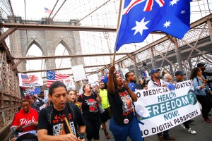 People march as they protest against NYC's coronavirus vaccine mandate that went into effect today for public school employees on October 04, 2021 in New York City.