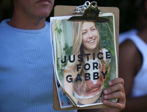 Supporters of "Justice for Gabby" gathered at the entrance of Myakkahatchee Creek Environmental Park in North Port Florida on Wednesday October 20, 2021. (Thomas O'Neill/NurPhoto via AP)​