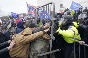 Trump supporters attempt to breakdown the fences in front of Congress on January 6, 2021. They forced their way into the building later that day.