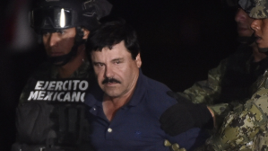 Drug kingpin Joaquin "El Chapo" Guzman is escorted to a helicopter at Mexico City's airport on January 8, 2016 following his recapture during an intense military operation in Los Mochis, in Sinaloa State.