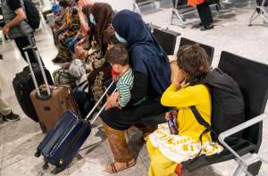 Refugees from Afghanistan wait to be processed after arriving on a evacuation flight at Heathrow Airport on August 26, 2021