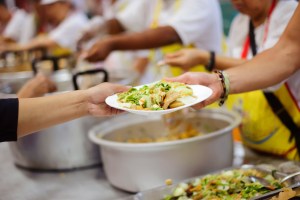 Warm food for the poor and homeless being given out at a soup kitchen