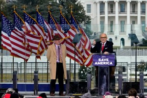 Director of the Claremont Institute’s Center for Constitutional Jurisprudence John Eastman stands next to Rudolph Giuliani in support of former President Donald Trump’s “Save America Rally” on Jan. 6, 2021.