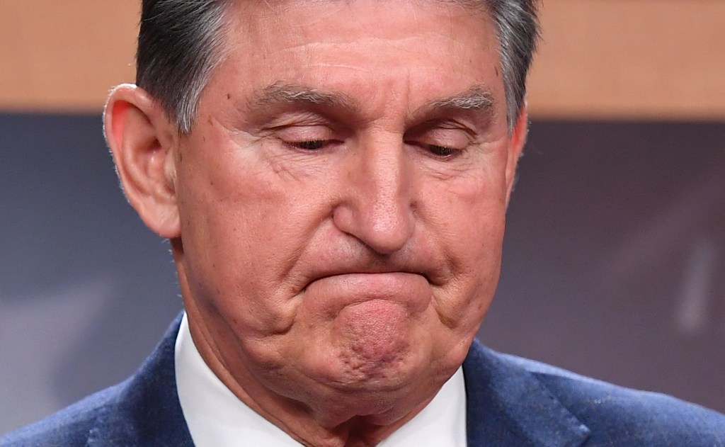 US Senator Joe Manchin, D-WV, reacts during a press conference as he talks about his position on US President Joe Bidens sweeping economic agenda on Capitol Hill in Washington, DC, on November 1, 2021.