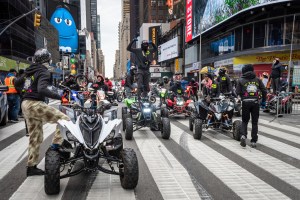 A group of dirt bikes and four-wheelers drive through Times Square in New York City on October 25, 2020.