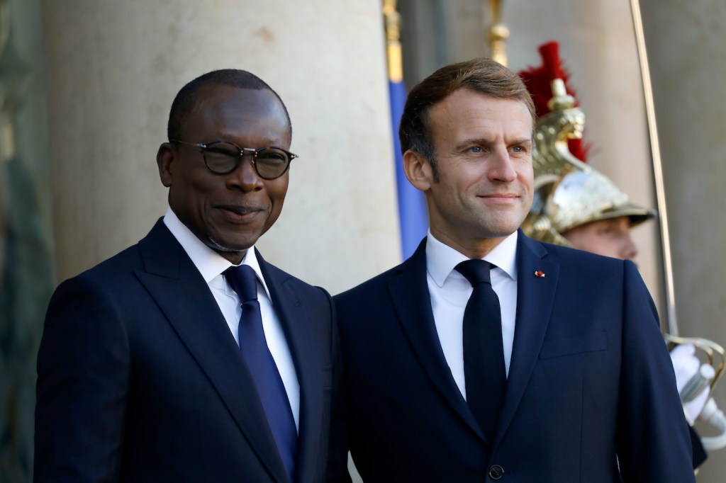 French President Emmanuel Macron (R) welcomes Benin's President Patrice Talon at the Elysee Palace in Paris.