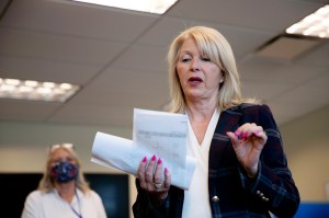 In this June 30, 2020, file photo, Mesa County Clerk Tina Peters reads an update on the election in Grand Junction, Colo. (McKenzie Lange/The Grand Junction Daily Sentinel via AP, File)