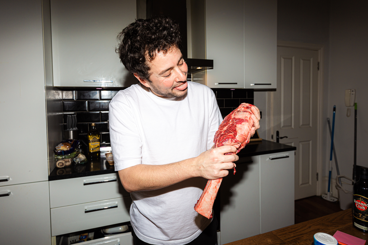 The author holding the raw steak