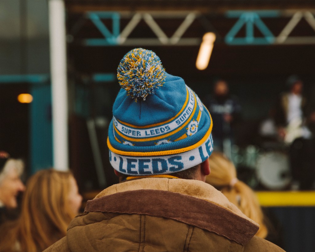 A Leeds supporter in a Leeds United hat