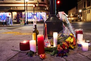 A makeshift memorial is pictured along the route of the parade on W Main Street in Waukesha, Wisconsin on November 22, 2021, the day after a vehicle drove through a Christmas parade killing five people. - US authorities identified the driver suspected of