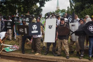 White supremacists form a shield wall at the edge of Lee park on 12 August 2017 in Charlottesville, Virginia.