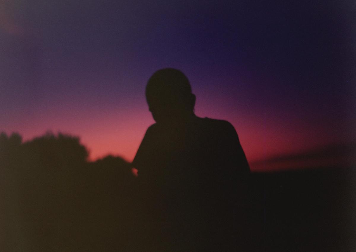 Of Manifesto, Belgium, porn - Hazy photo of a silhouetted human figure at dusk.