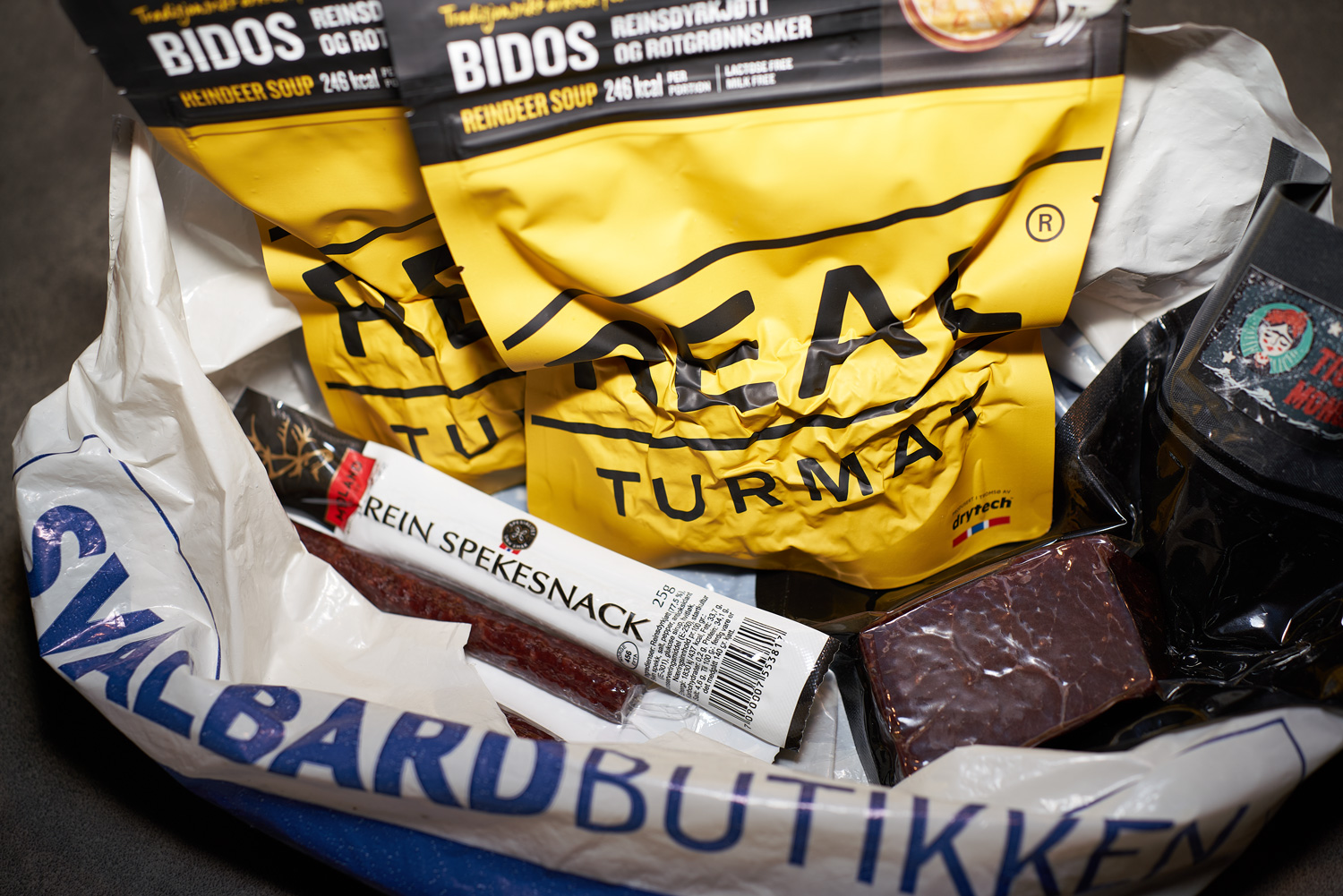 Arctic cuisine, Svalbard, Nick Casini - Photo of assorted plastic packaged food items in a plastic carrier bag,