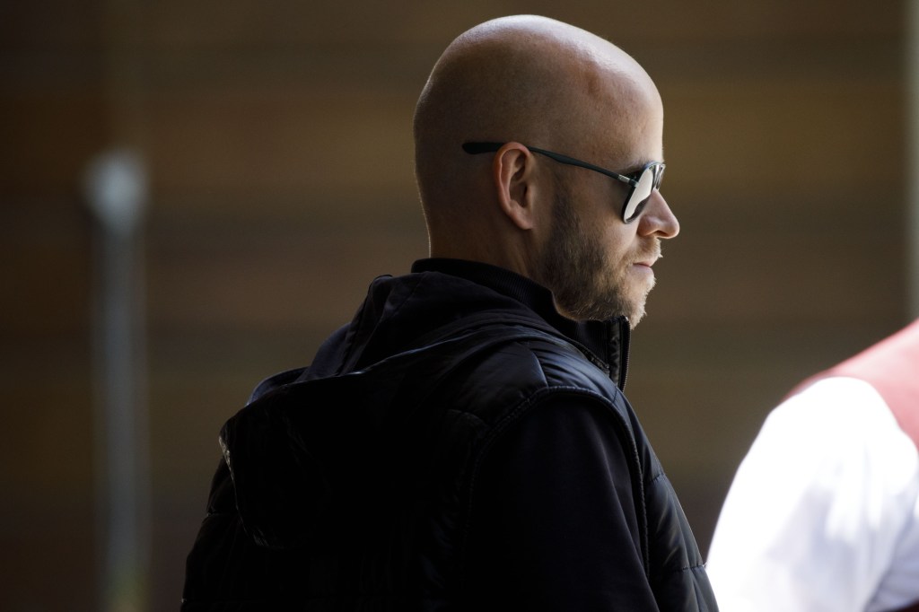 Spotify CEO Daniel Ek wearing a black jacket and sunglasses.