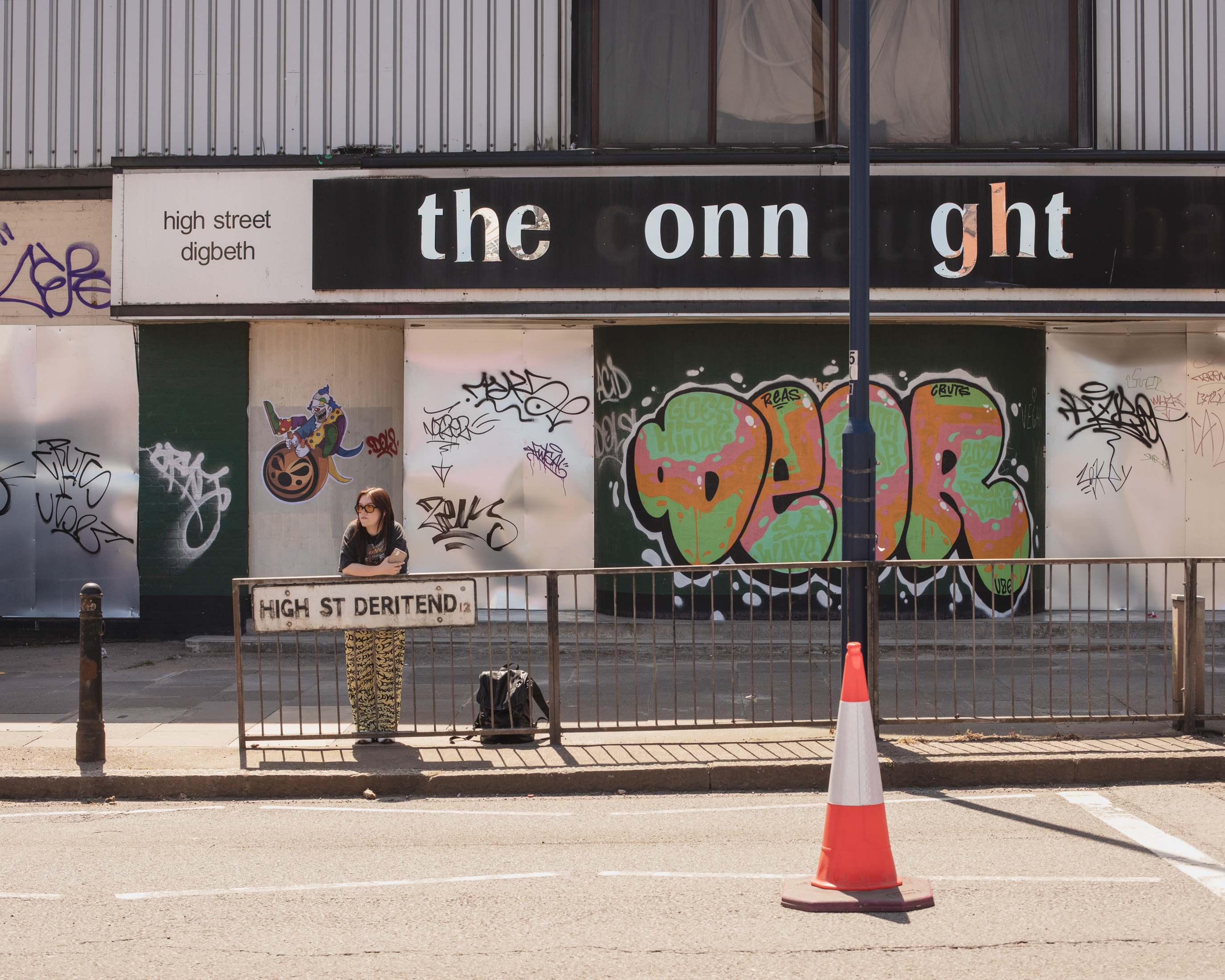 VICE writer Lauren O'Neill in Birmingham standing by a road sign