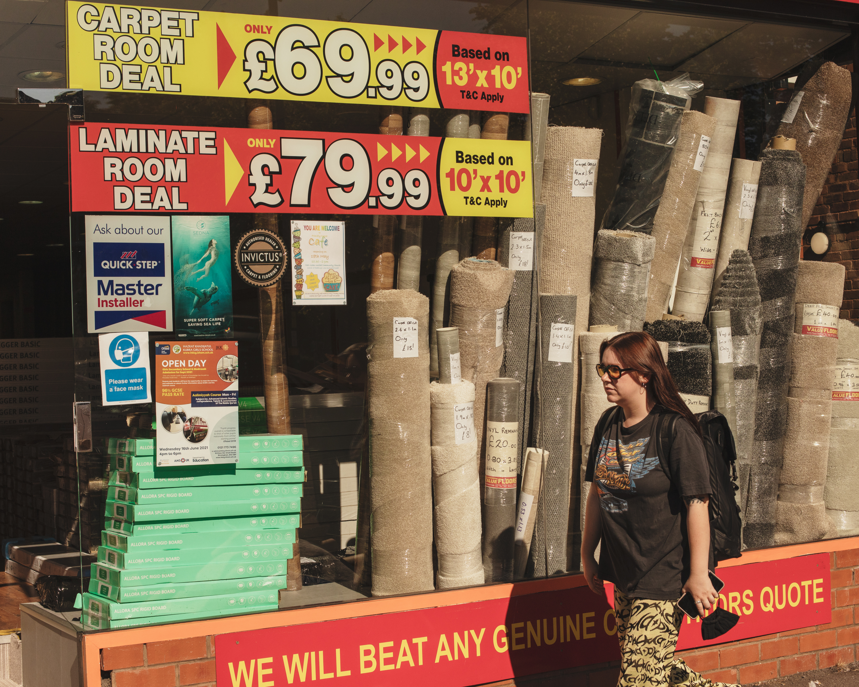 VICE writer Lauren O'Neill in Birmingham walking past a home decor store