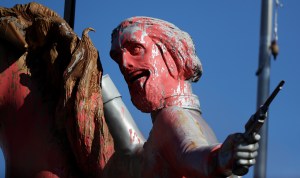 In this Dec. 28, 2017, photo, a statue of Nathan Bedford Forrest, a Confederate Army general and the first grand wizard of the Ku Klux Klan, is splattered with pink paint after being vandalized in Nashville, Tenn. (AP Photo/Mark Humphrey)