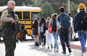 Students are evacuated from Saugus High School onto a school bus after a shooting at the school left two students dead and three wounded on November 14, 2019 in Santa Clarita, California.