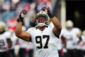 Defensive end Glenn Foster #97 of the New Orleans Saints takes the field before the start of the Saints and New England Patriots game at Gillette Stadium on October 13, 2013 in Foxboro, Massachusetts.