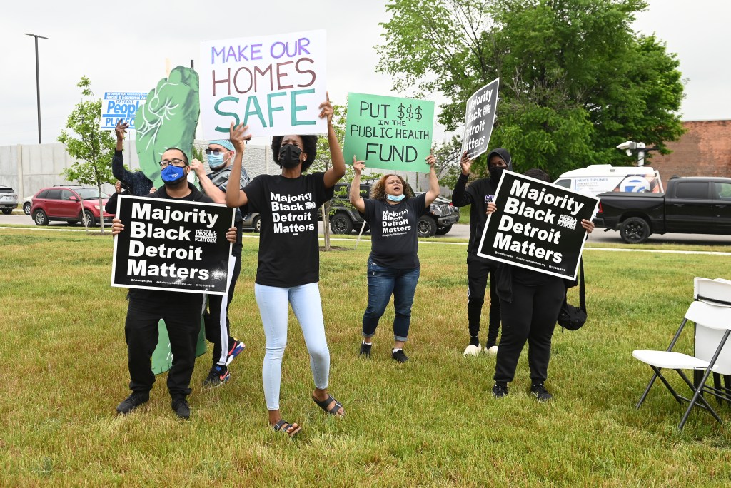 Protesters from Detroit People's Platform protest environmental issues during a press conference, Thursday, June 3, 2021, in Detroit.