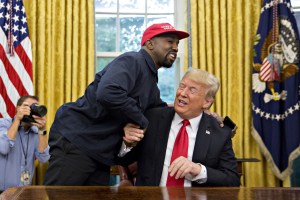 Rapper Kanye West, left, shakes hands with U.S. President Donald Trump during a meeting in the Oval Office of the White House in Washington, D.C., U.S., on Thursday, Oct. 11, 2018.