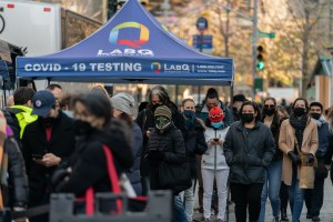 People stand in line at Covid-19 mobile testing site in New York, U.S., on Sunday, Dec. 5, 2021.