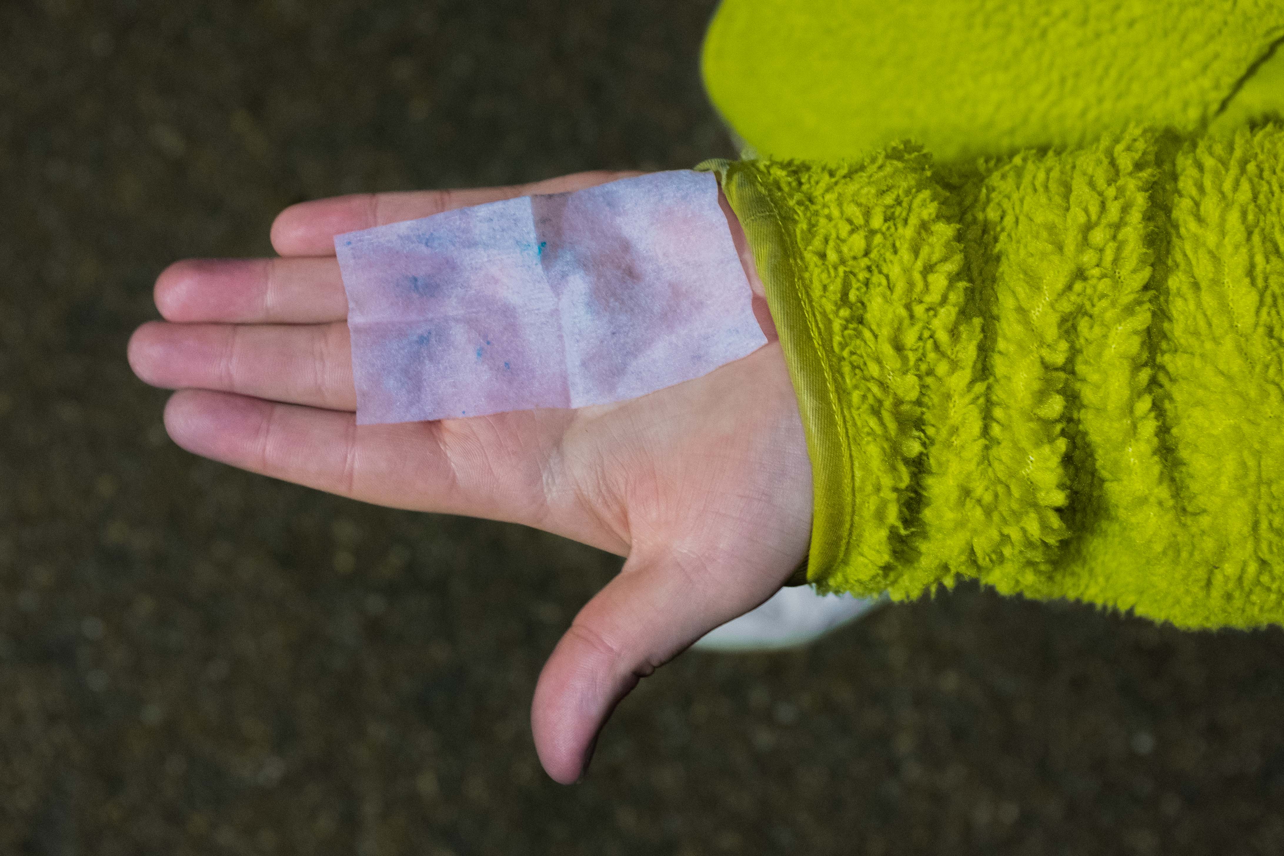 A hand with a cocaine wipe showing positive for cocaine use at Winter Wonderland