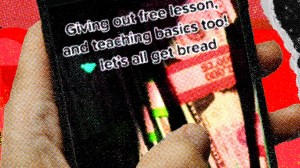 A hand holding a phone that says "giving out free lesson and teaching basics too! Let's all get bread"