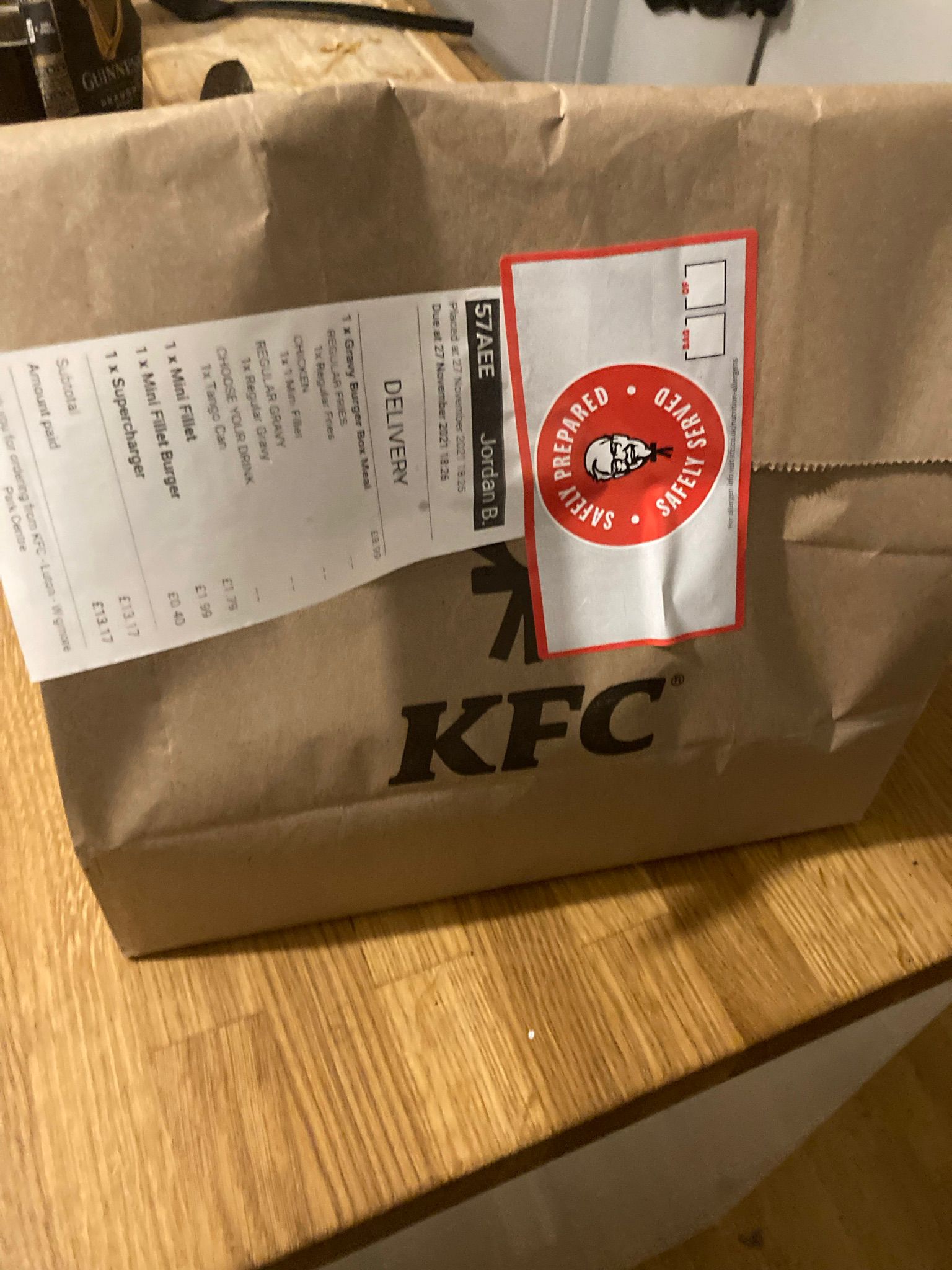 The KFC Gravy Burger Box Meal in a bag.