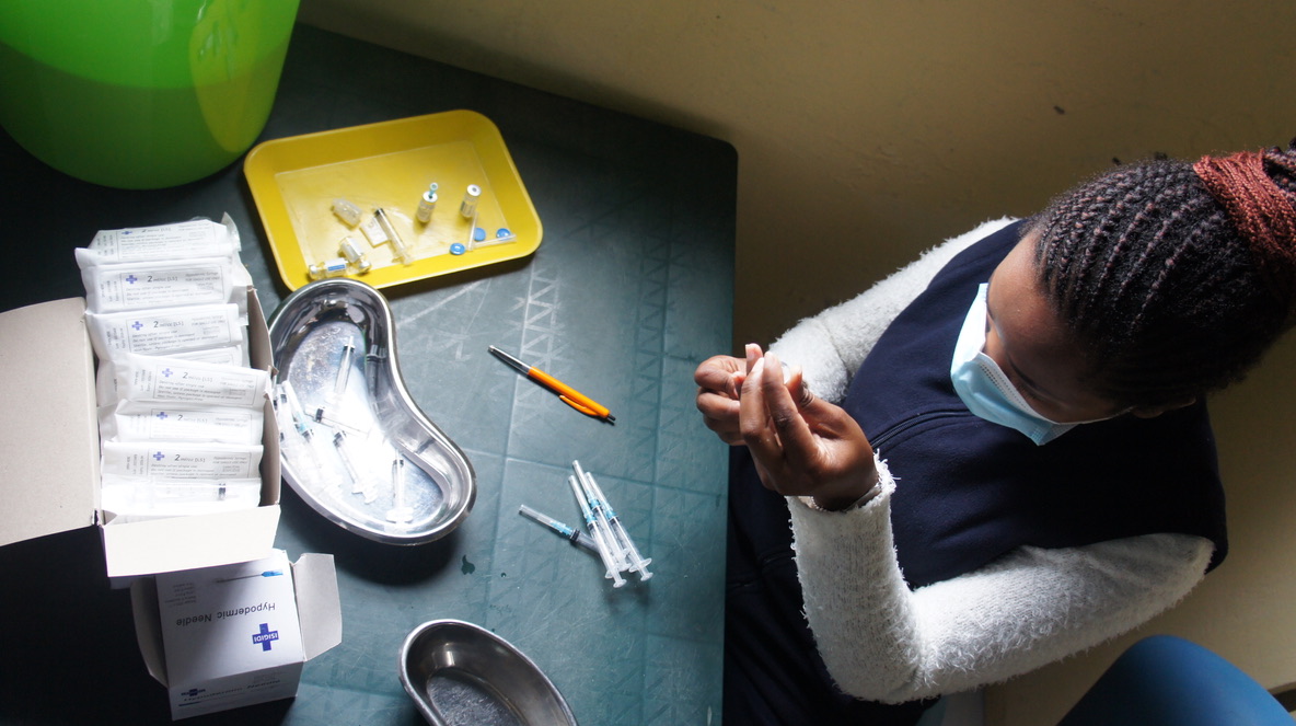 Bulungula Health Point Nurse preparing vaccine.jpeg