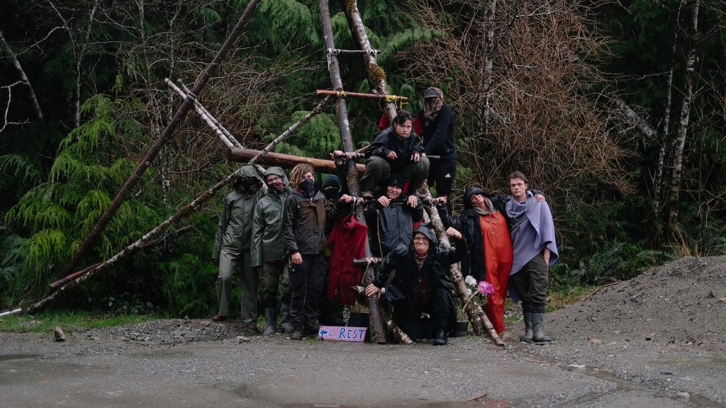 Whale Tail Jones, Raven Brascoupe, and Many Spirit Warrior front and centre on the ladder with others at Fairy Creek.