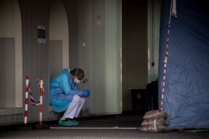 A nurse rests while treating COVID patients on March 27, 2020, in Rome, Italy.