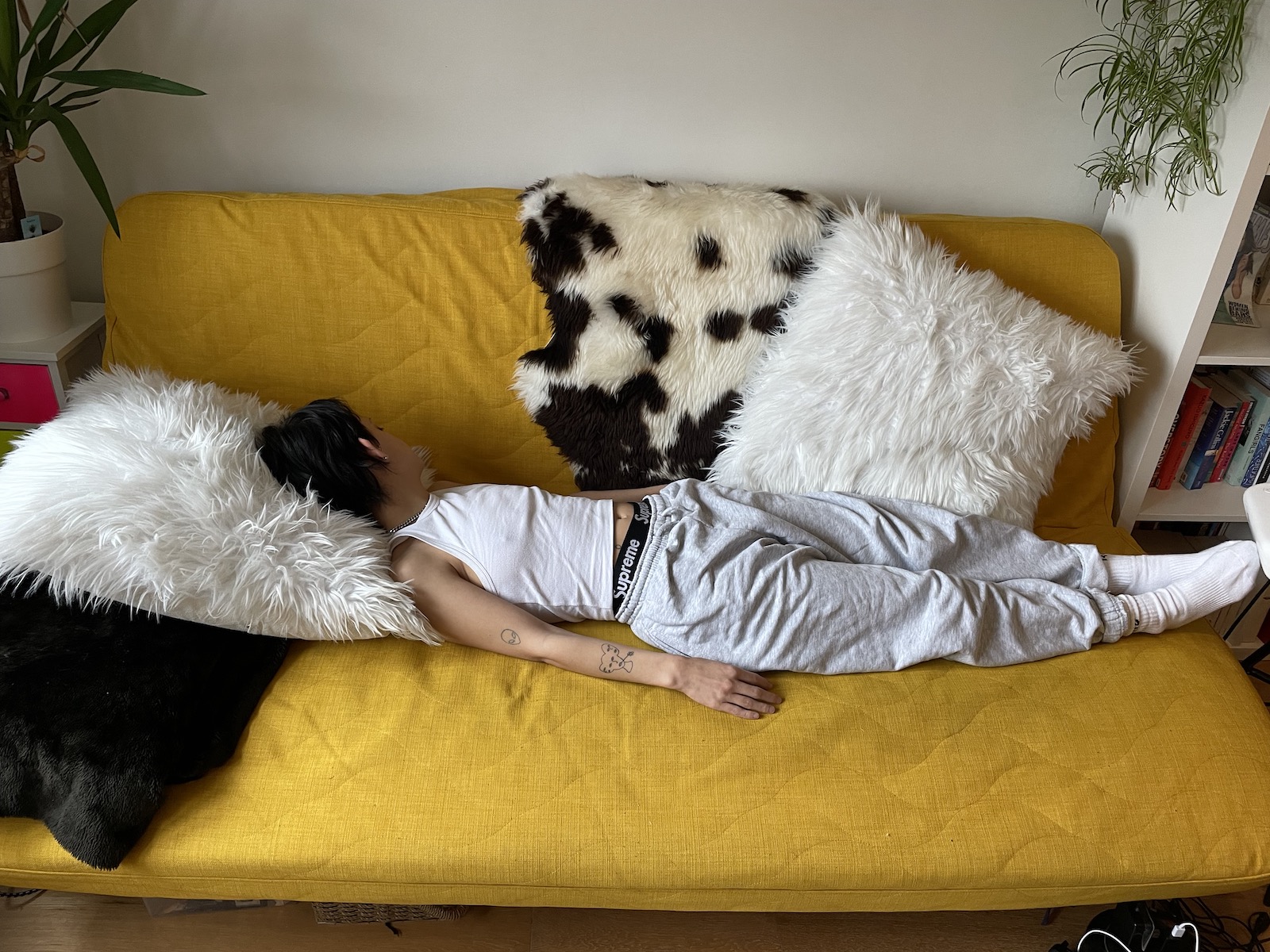 The author lying on a sofa