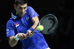 Novak Djokovic playing tennis.