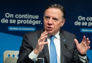 Quebec Premier Francois Legault speaks during a news conference in Montreal, Thursday, December 30, 2021, where he gave an update on the ongoing COVID-19 pandemic in the province.