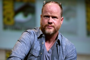 A photo of Joss Whedon on a panel at Comic Con 2016