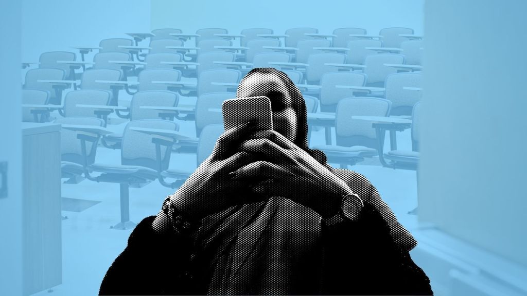 Seats in an empty lecture hall. Photo: Hill Street Studios via Getty Images. Young woman using smartphone against building in city.