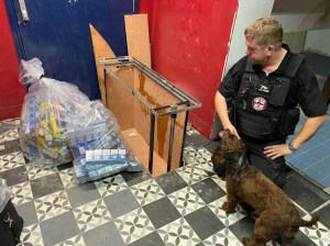 Derbyshire - Dog handler Stu Phillips - cache rises from floor on hydraulics