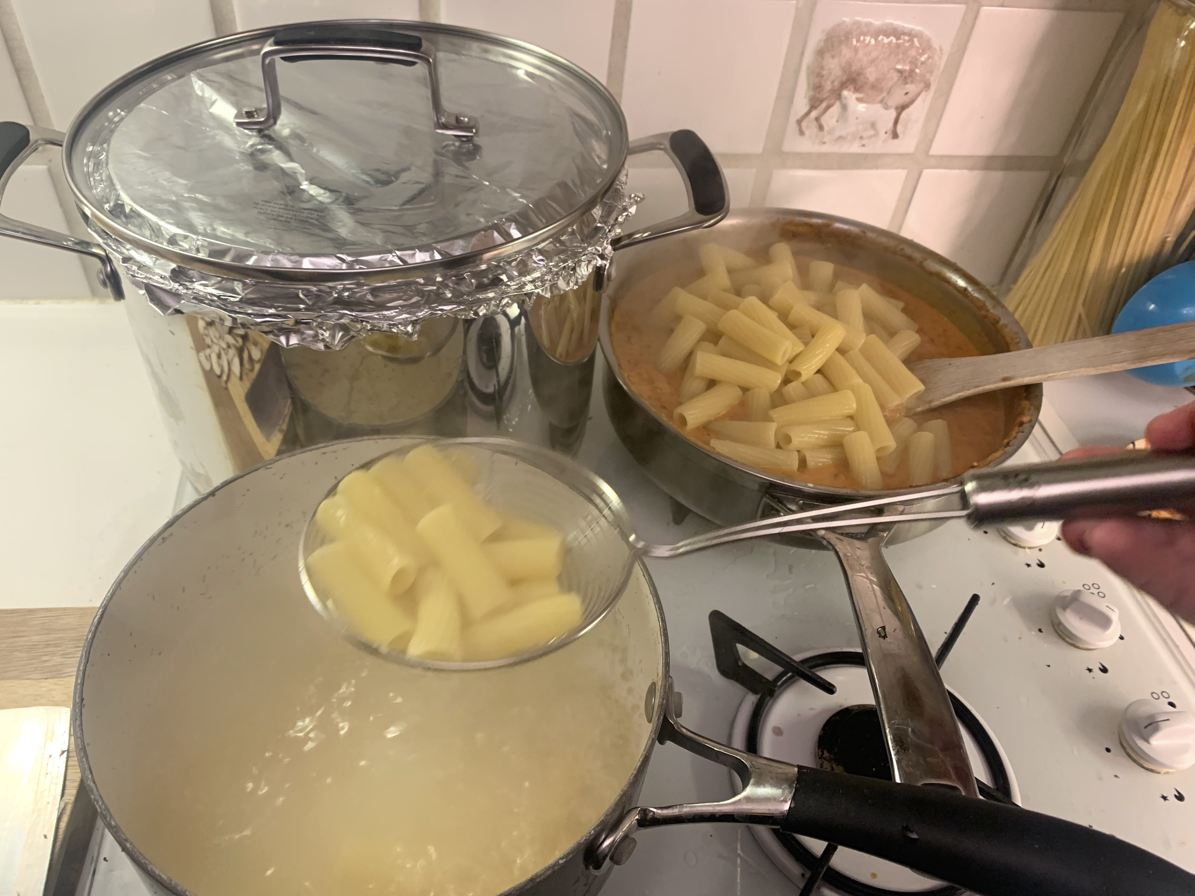 Pans of pasta cooking David Cameron's recipe for Italian sausage meat pasta